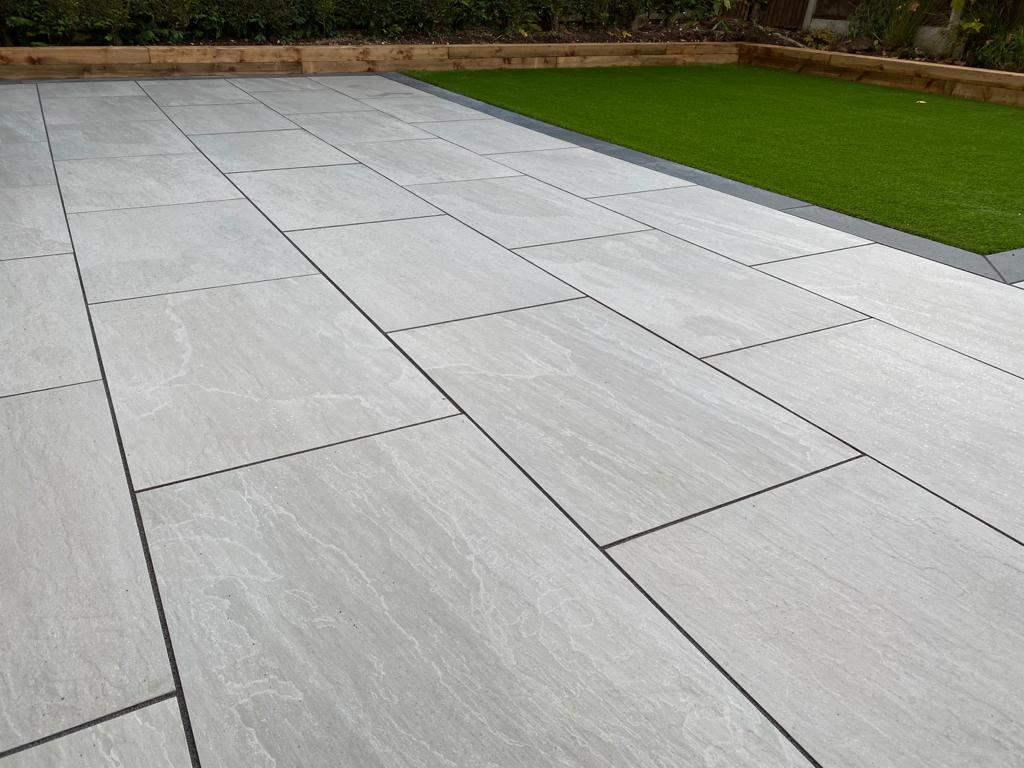 porcelain patio pavers,marshalls arrento,porcelain garden paving,grey porcelain slabs 600x600,laying porcelain paving,wood effect slabs,grey porcelain paving